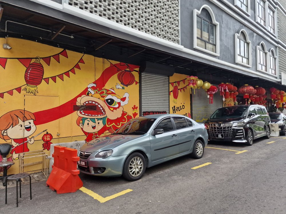 Ulička s pouličným umením Street art v Kuala Lumpur